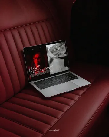 Laptop showing a social campaign on a red leather seat